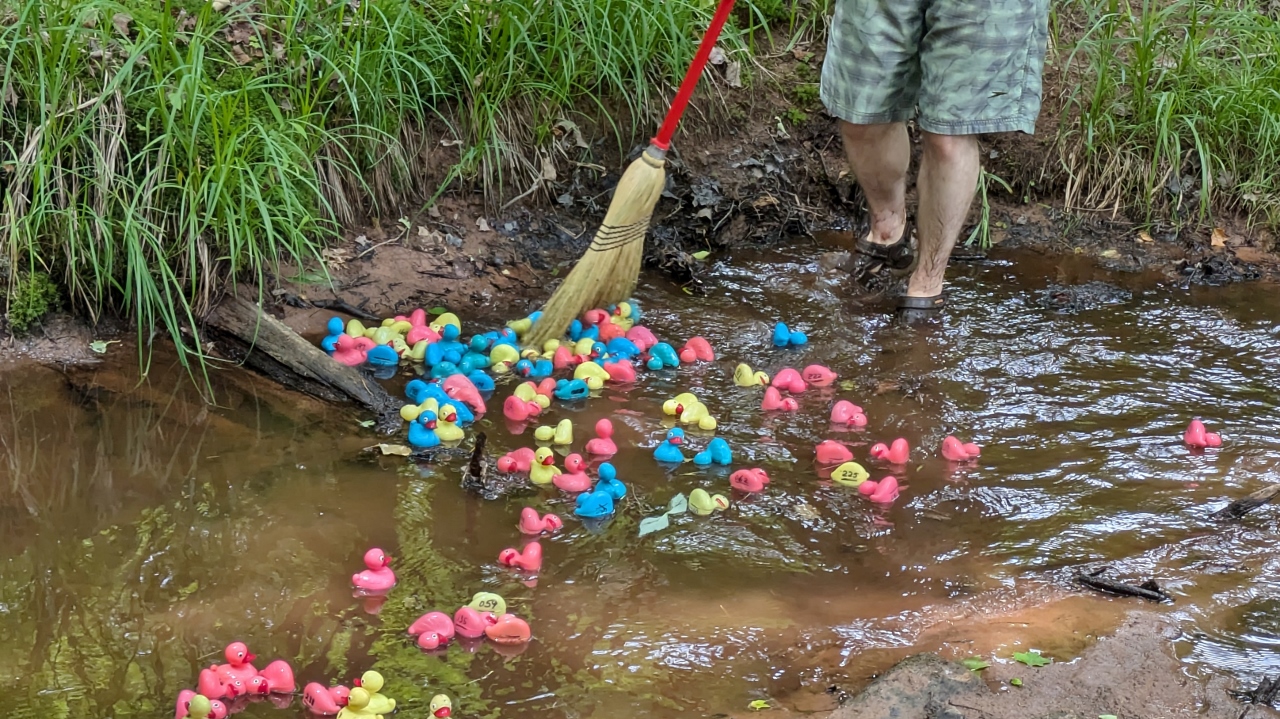 Broom Helps Keep Race Moving Along