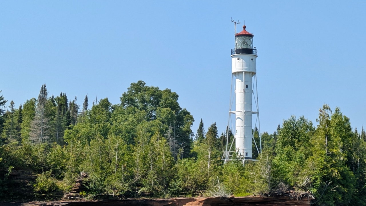Devils Island Lighthouse Hovers Above Sea Caves