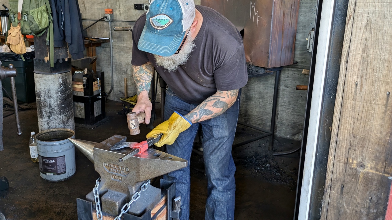 Student Refines Shape of Axe Head Eye