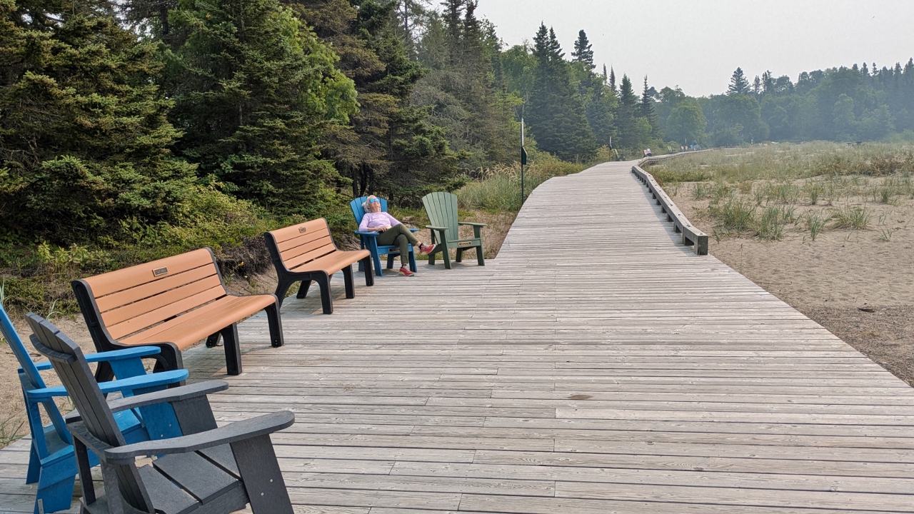 Sandy Relaxes on Terrace Bay Boardwalk