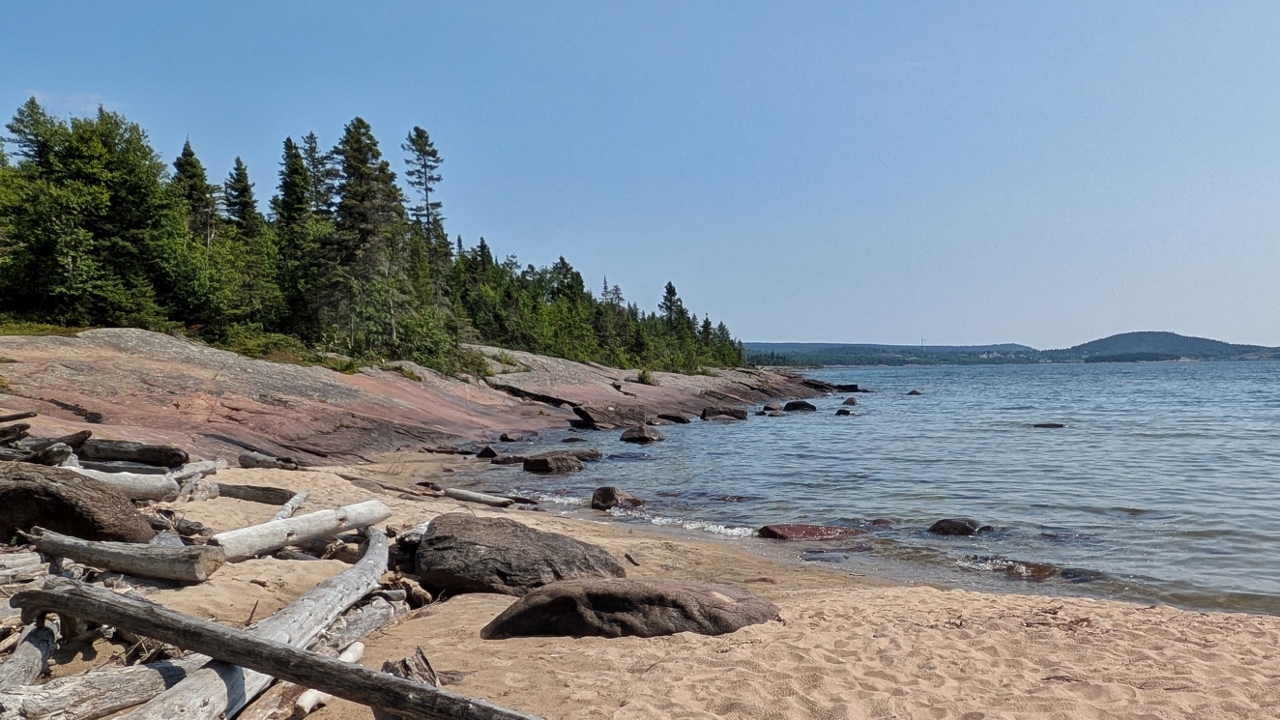 Soft Sand Ends at Smooth Rock Shore