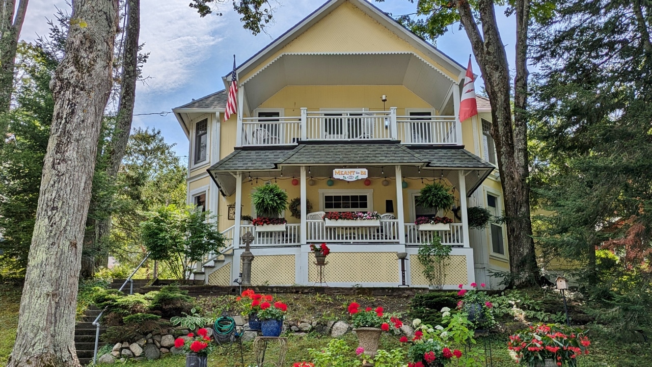 House Displayed Both Flags and Paper Lanterns