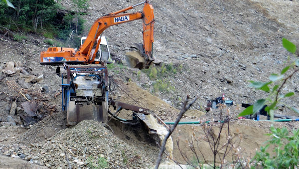 Typical Modern, One-Man, Gold-Mining Backhoe and Sluice Operation