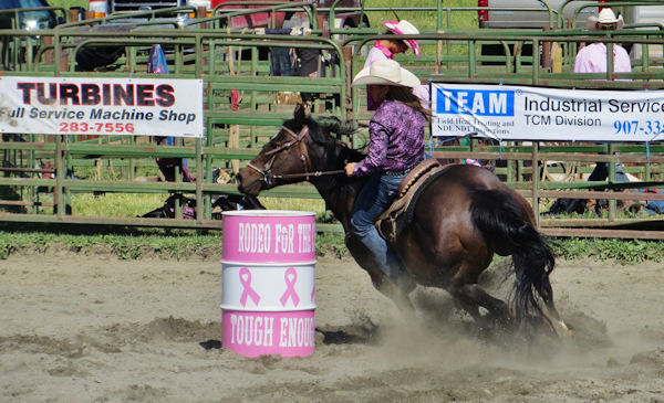 Tight Turns Make for Fast Times in Rodeo Barrel Racing Contest
