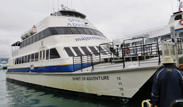 Spirit of Adventure Catmaran Tour Boat awaits Passengers