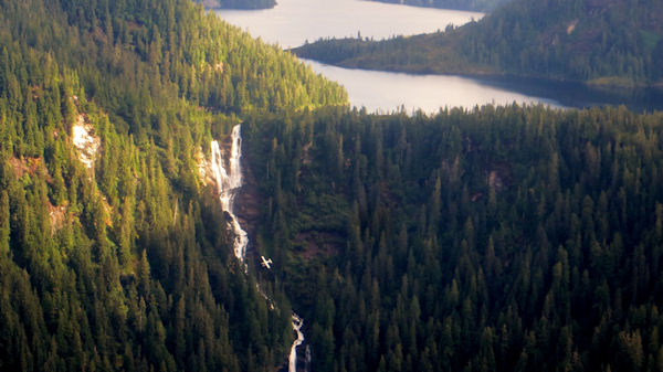 Waterfall Begins at Edge of Hanging Lake. (Note Small Plane Near Falls)