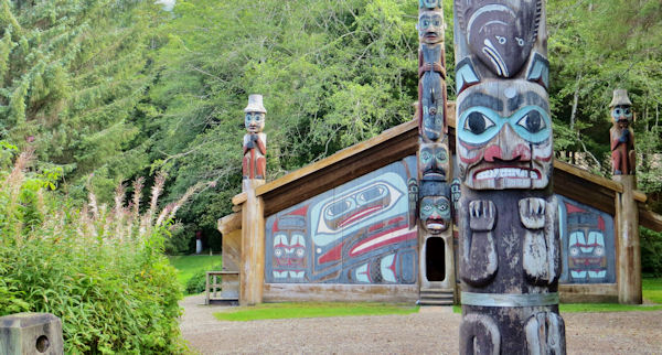 Some of the Totem Poles and the Clan House at Totem Bight