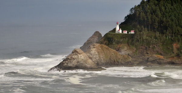 Heceta Lighthouse Stands Vigil above Rocky Shoreline