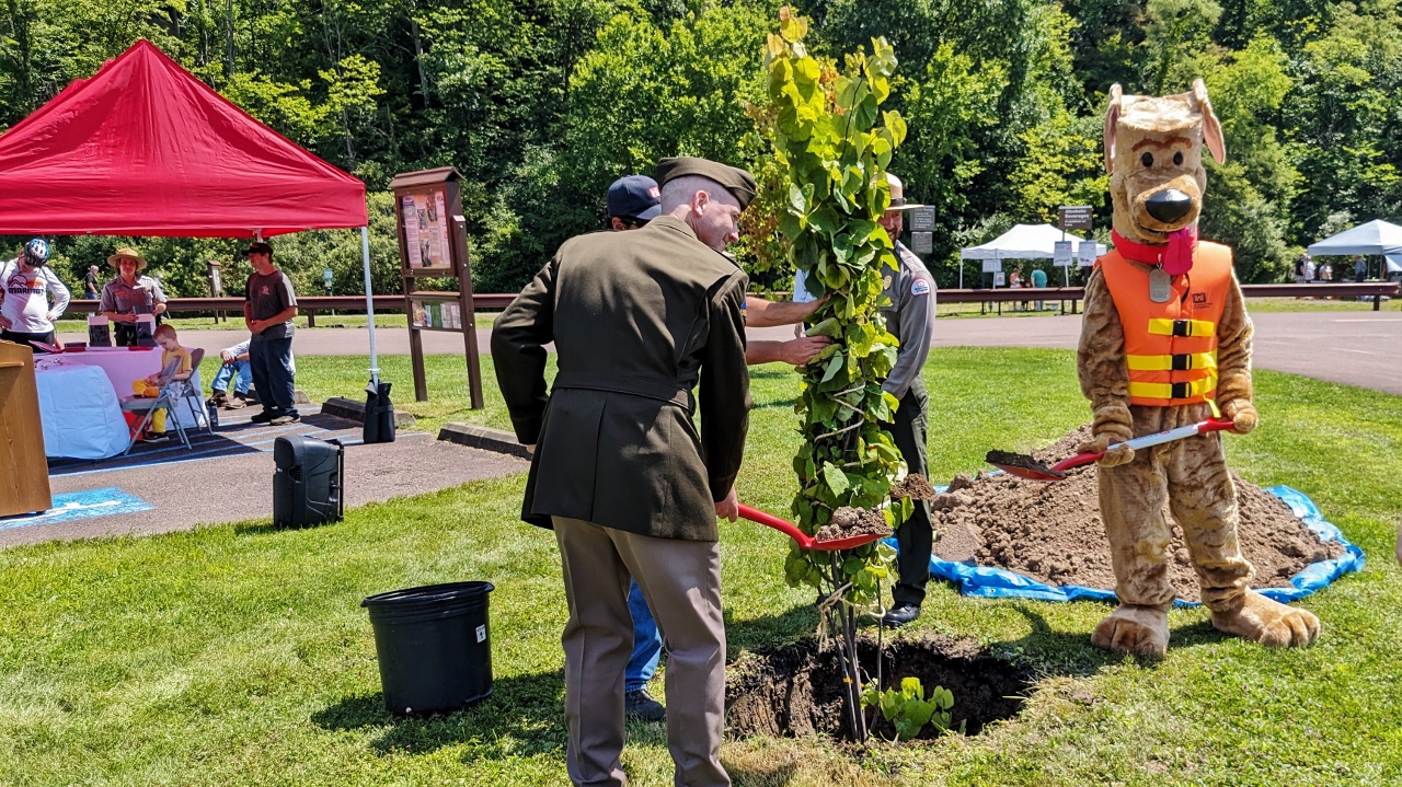 Corps of Engineers Play Redbud Tree to Mark Location of Time Capsule