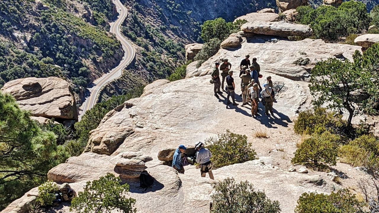 Group Preparing to Rappel Over the Side